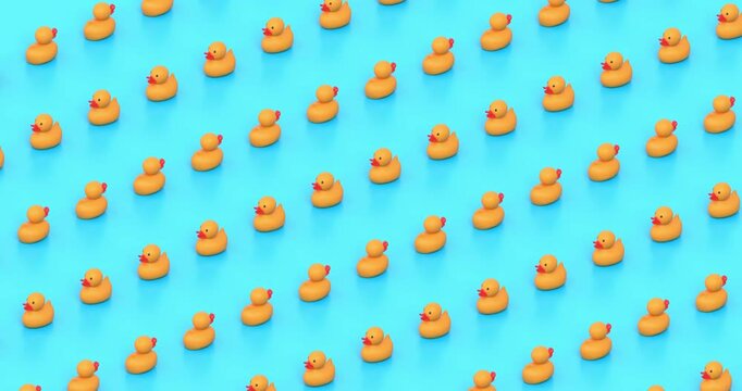 Small Yellow Rubber Ducks Move in Rows Seamlessly in a Diagonal Orthographic View Against Light Blue Background