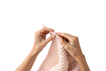 Hands knitting pink yarn, demonstrating knitting technique with metal needles actively, isolated on a transparent background