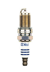 A spark plug with a metallic body and white insulator, displayed on a transparent background. The spark plug is designed for automotive engines.