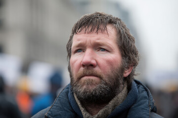 Fototapeta premium striking portrait of homeless american mans face showcasing exaggerated emotions of despair and determination