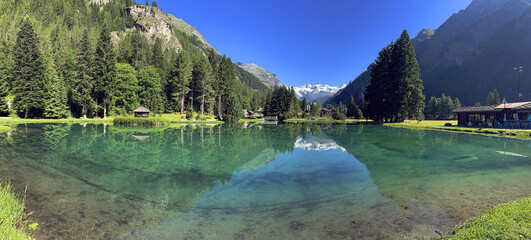 reflection in lake and mountains in gressoney italy

