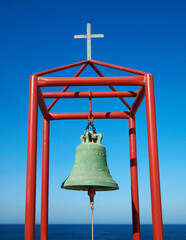 the belfry of a greek orthodox church against blue sky