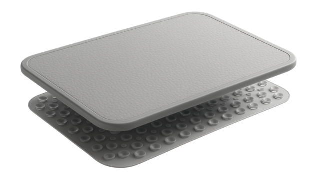A rectangular anti-slip bath mat made of soft rubber with suction cups underneath, ideal for a family bathroom.