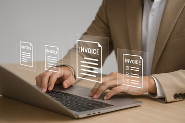 Businessman using laptop to manage electronic statements on virtual screen. E-Invoice and Digital billing concept. 