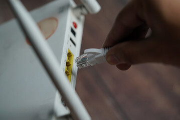 ethernet internet cat6 lan white cable close up shot on dark theme background 
