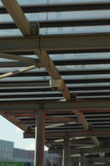 The image depicts the structural framework of the canopy, showcasing a security camera thoughtfully...