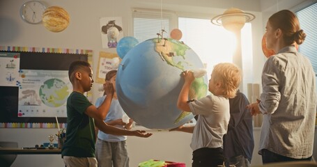 Renewable Energy STEM Class: Elementary School Students Attaching Miniature Models of Clouds to...