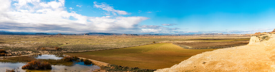 Obraz premium Panorama with small lake and fields