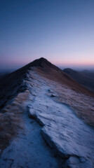 Obraz premium Rugged mountain path at twilight with serene glow
