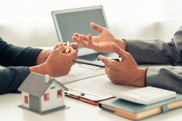 The real estate agent discussed the terms of the home purchase contract and asked the client to...