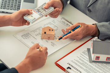 The real estate agent discussed the terms of the home purchase contract and asked the client to...