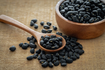 Black bean on wooden spoon