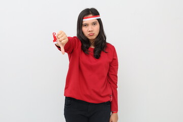 Indonesian woman unhappy with red and white ribbon celebrating Indonesian independence day while...