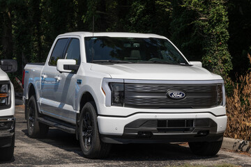 Ford F-150 Lightning 4X4 Supercrew EV display. Ford offers the F150 Lightning with up to 320 miles of driving range. MY:2025