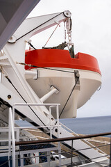 Lifeboat hanging on cruise deck