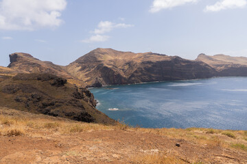 Obraz premium Coastal cliffs and blue sea, horizontal