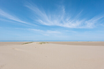 Cirrus clouds above beach, wispy, feathery clouds made of long strands of ice crystals