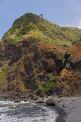 Colorful coastal mountain rocks Vertical