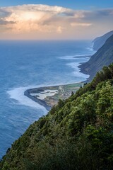 Dramatic Coastal Cliffs And Faja Landscape On Sao Jorge Island Azores Portugal. Elevated Ocean View, Volcanic Coastline, Lush Green Vegetation, Atlantic Island Scenic Beauty, Portuguese Nature