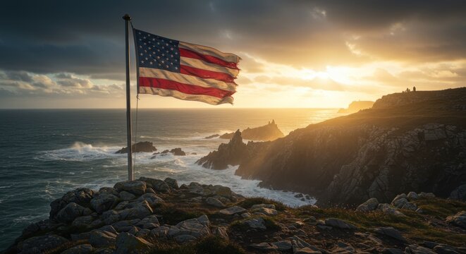 United States flag waving against a picturesque coastal landscape at sunset evokes patriotism - Powered by Adobe