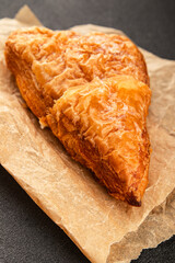 Triangle cake almond puff pastry sweet dessert fresh delicious gourmet food background on the table rustic food top view copy space