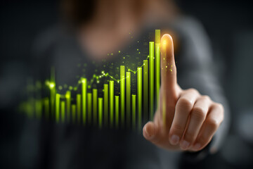 Person touching a glowing green digital financial graph with rising bars