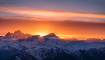 majestic sunrise casts first light over snow capped mountain peaks in tranquil morning atmosphere