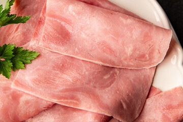Ham slices meat spam pork fresh delicious gourmet food background on the table rustic food top view...