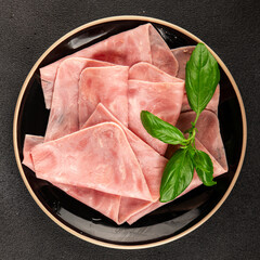 Ham slices meat spam pork fresh delicious gourmet food background on the table rustic food top view...