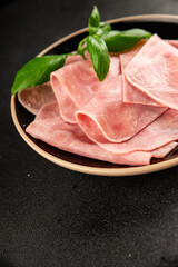 Ham slices meat spam pork fresh delicious gourmet food background on the table rustic food top view copy space
