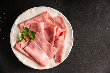 Ham slices meat spam pork fresh delicious gourmet food background on the table rustic food top view...