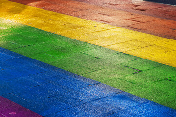 Vibrant rainbow colored path. Regenboogvlag on Grote Marktstraat in the Hague, Netherlands....