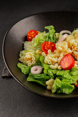 Pasta salad green leaf lettuce, tomato, pasta, onion fresh delicious gourmet food background on the table rustic food top view copy space keto and paleo diet vegan and vegetarian food