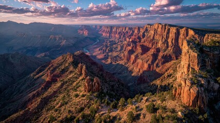 Stunning canyon landscape with rugged cliffs, vibrant colors, and dramatic clouds in a vast natural setting.