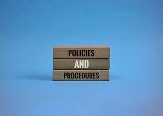 Policies and Procedures Blocks on blue Background Displaying Professional Concept