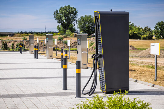 Power supply for electric car charging, charger at parking lot.