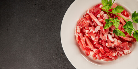 Bacon cubes smoked chopped meat small pieces fresh delicious gourmet food background on table...