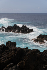 Madeira coastline with volcanic rocks vertical