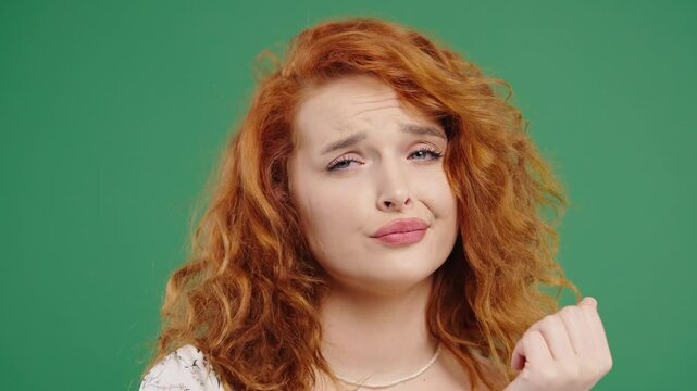 Bored red-haired woman pretending to yawn and roll eyes during awkward situation