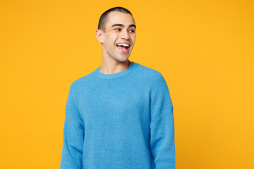 Young shocked surprised fun happy middle eastern man wearing blue sweatshirt casual clothes looking...