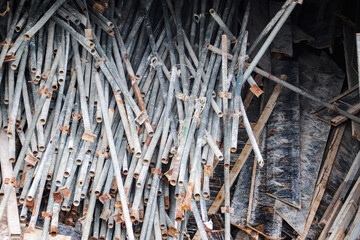 Pile of scaffolding materials stored for reuse at nearby construction site