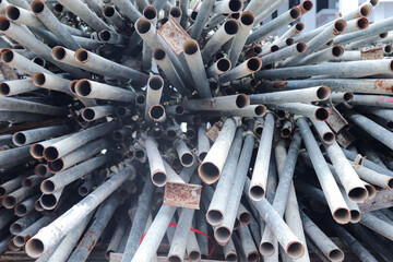 Scaffolding metal tubes closely packed, ready for next construction phase