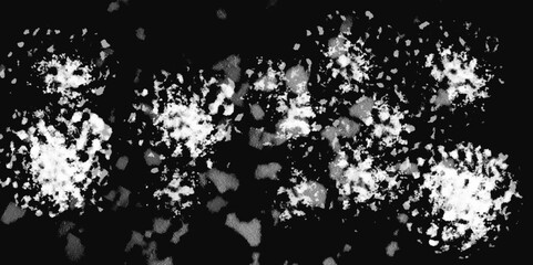 White snowflakes on a black background surface. Macro nature pattern backdrop. Snow overlay background isolated on black. Winter concept. scratches and cracks which can be used as a background.