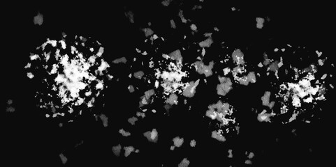 White snowflakes on a black background surface. Macro nature pattern backdrop. Snow overlay background isolated on black. Winter concept. scratches and cracks which can be used as a background.