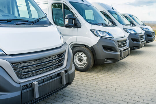 Commercial delivery vans parking in a row, transporting and shipping service company