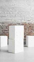 A minimalist scene featuring white geometric blocks on a polished floor, against a textured brick wall, Ideal for design, architecture, or creative projects needing a modern aesthetic,