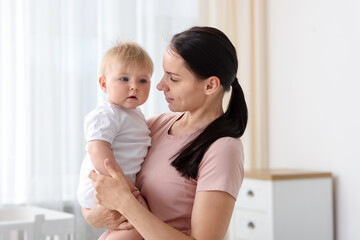 Mother with her little baby at home