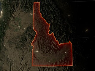 Detailed night map of Idaho with red state borders and glowing city lights. Contains modified Copernicus Sentinel data 2025.