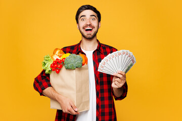Young man wear casual clothes hold paper bag for takeaway mock up with food products, fan cash...