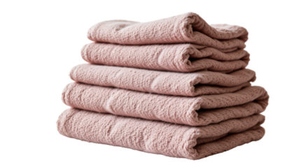 stacked towels in neat piles against a dark background
